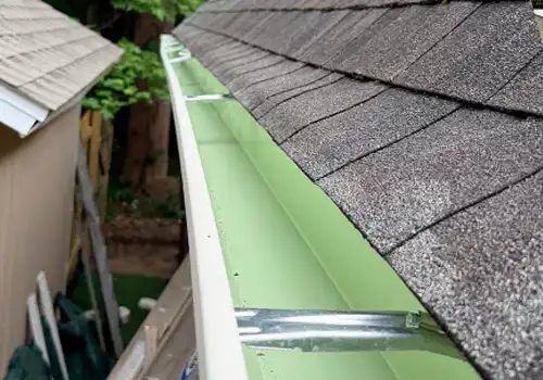 Roof with gutters installed by Solify Gutters